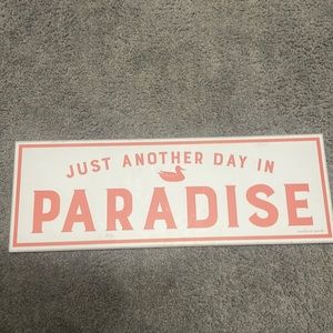 White and pink Paradise sign